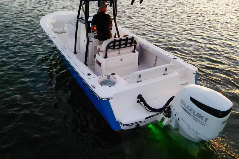 Slide: The Image of 2021 Sea Born LX24 Center Console boat with Suzuki outboard engine on water. - 31