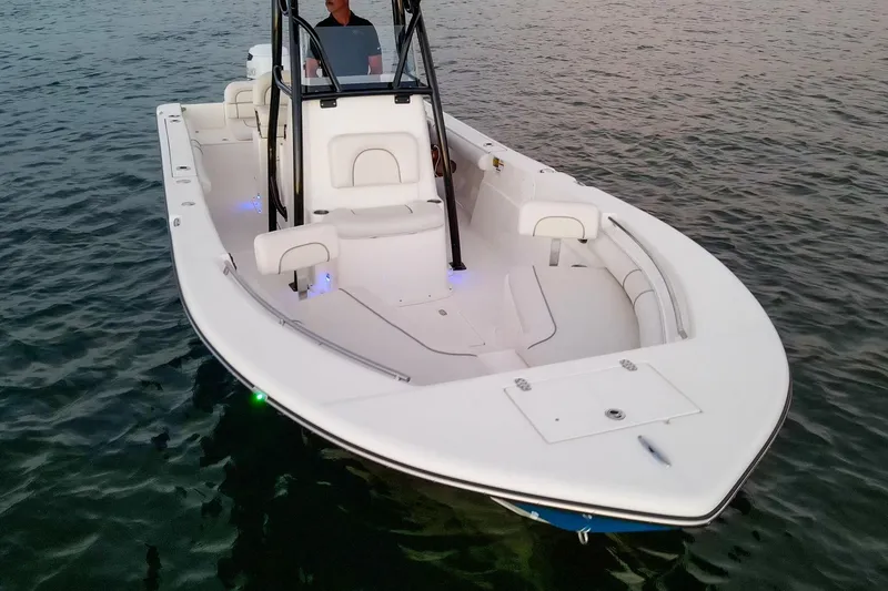 Slide: The Image of 2021 Sea Born LX24 Center Console boat on calm water at sunset. - 36