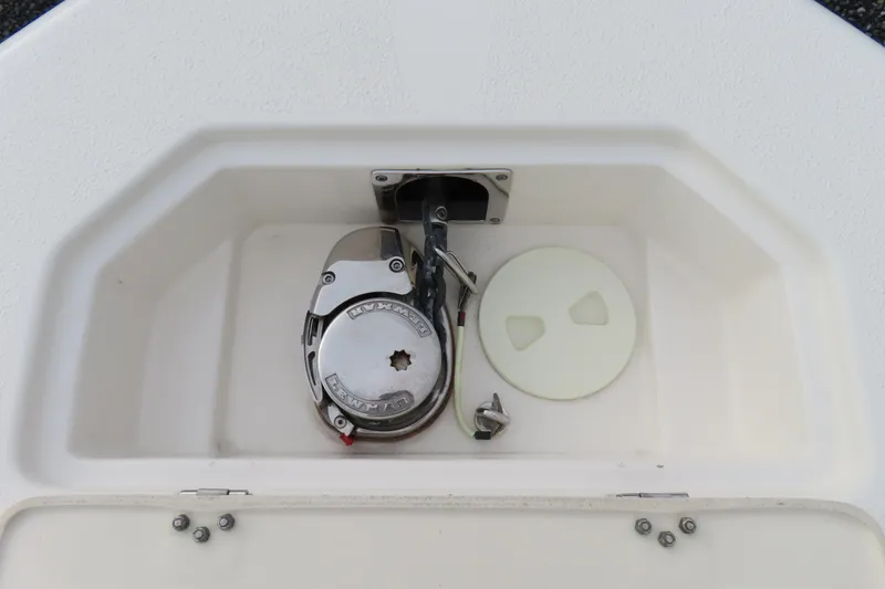 Slide: The Image of 2017 NauticStar 25 XS Offshore boat anchor compartment with Lewmar windlass system. - 14