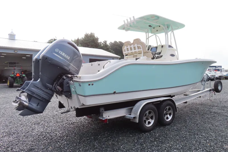 Slide: The Image of 2017 NauticStar 25 XS Offshore boat on trailer with Yamaha outboard engine. - 2