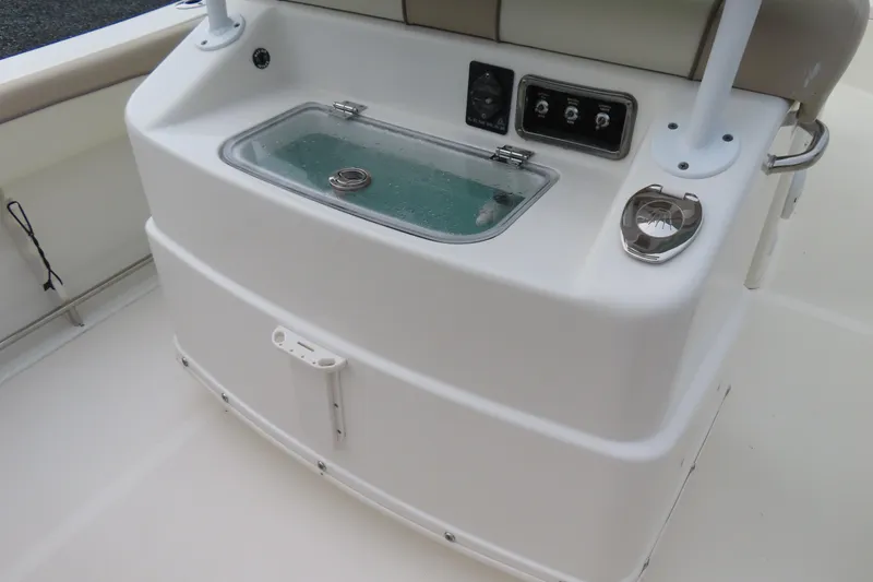 Slide: The Image of 2017 NauticStar 25 XS Offshore boat console with livewell and control panel. - 30