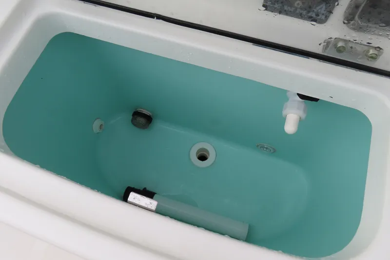 Slide: The Image of Livewell in 2017 NauticStar 25 XS Offshore boat, featuring clean interior and fittings. - 31