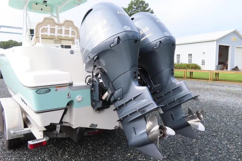 Slide: The Image of 2017 NauticStar 25 XS Offshore boat with dual Yamaha outboard engines. - 5