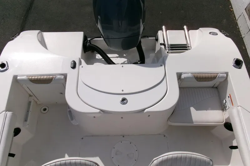 Slide: The Image of 2005 Seaswirl Striper 1851 Center Console boat interior with seating and motor view. - 20