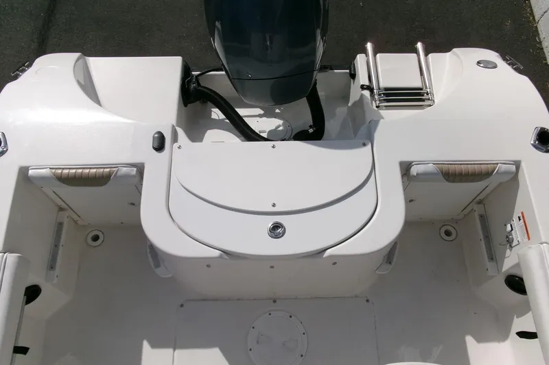 Slide: The Image of 2005 Seaswirl Striper 1851 Center Console boat interior with motor and seating. - 21