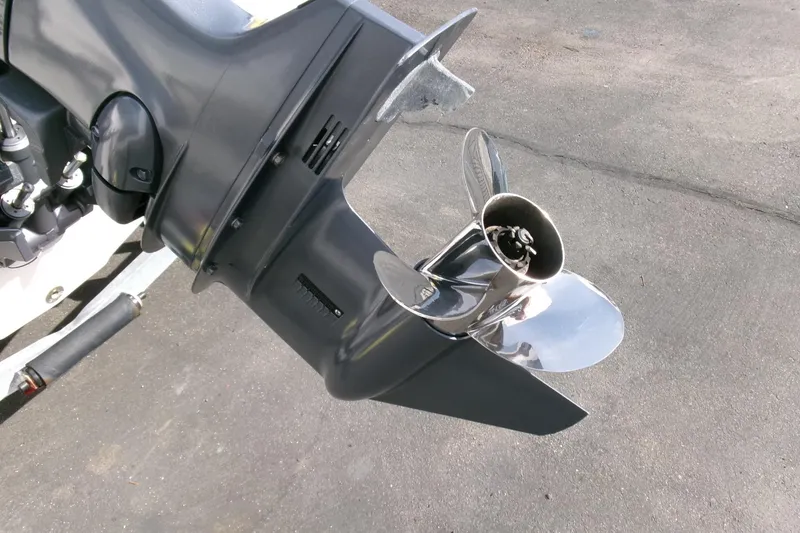 Slide: The Image of 2005 Seaswirl Striper 1851 Center Console boat propeller on pavement background. - 24