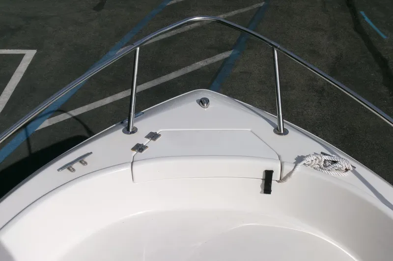 Slide: The Image of 2005 Seaswirl Striper 1851 Center Console boat bow with railing and rope. - 4