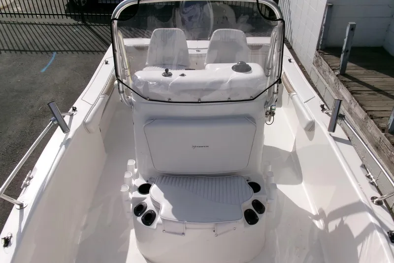 Slide: The Image of 2005 Seaswirl Striper 1851 Center Console boat interior with seating and console view. - 8