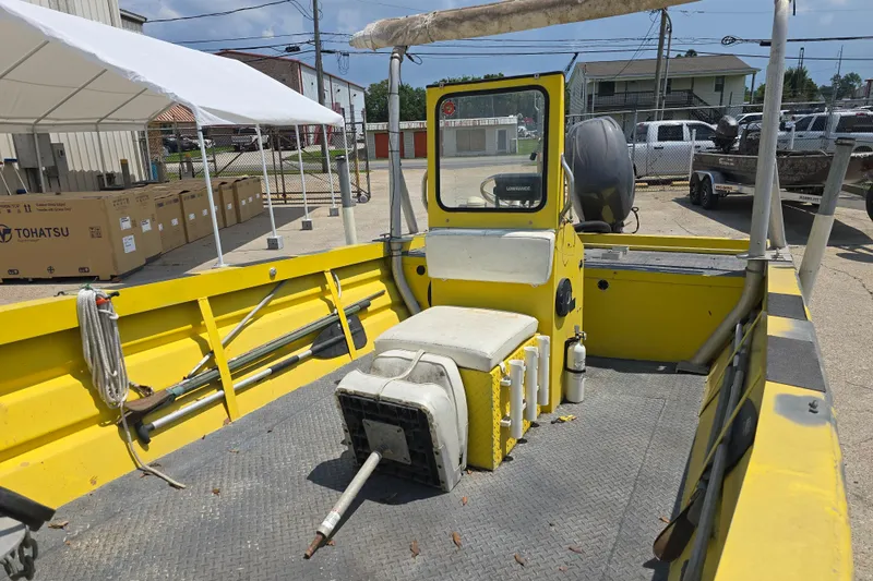 Slide: The Image of Yellow 2006 Rookie 22 boat interior with equipment and storage boxes. - 11