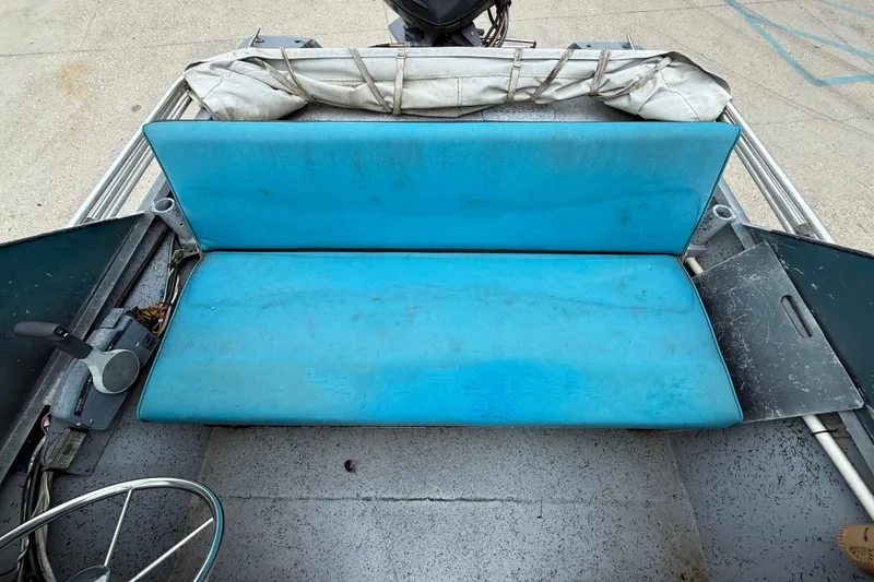 Slide: The Image of Blue bench seat in 1983 Scully's 16 WT boat interior. - 9