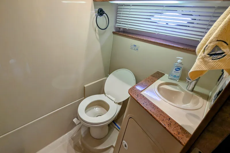Slide: The Image of Bathroom interior of 2000 Cruisers Yachts 3870 Express with toilet and sink. - 28