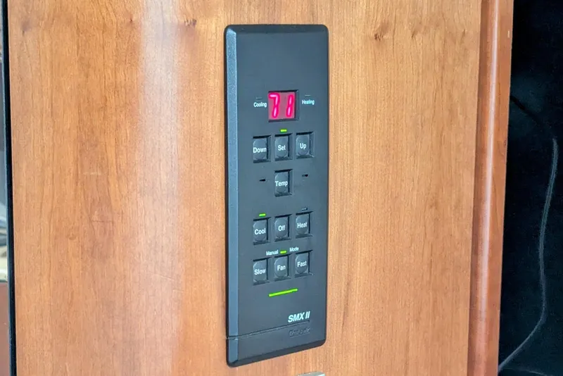 Slide: The Image of Control panel on 2000 Cruisers Yachts 3870 Express, displaying temperature settings. - 30