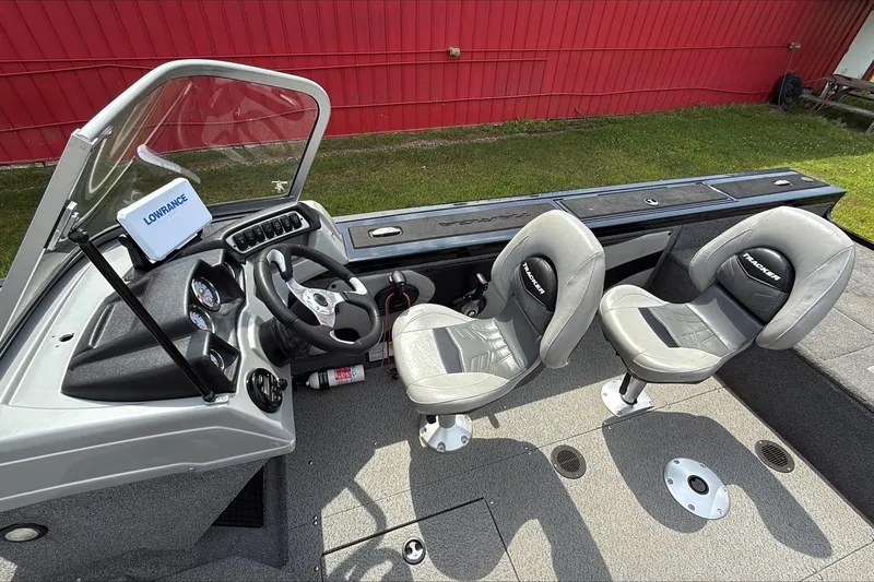 Slide: The Image of 2019 Tracker Targa V-19 WT Tournament Edition boat interior with dual seats and steering console. - 3