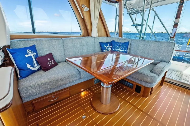 Slide: The Image of Luxurious 2019 Sabre Flybridge yacht interior with elegant seating and nautical-themed decor. - 15