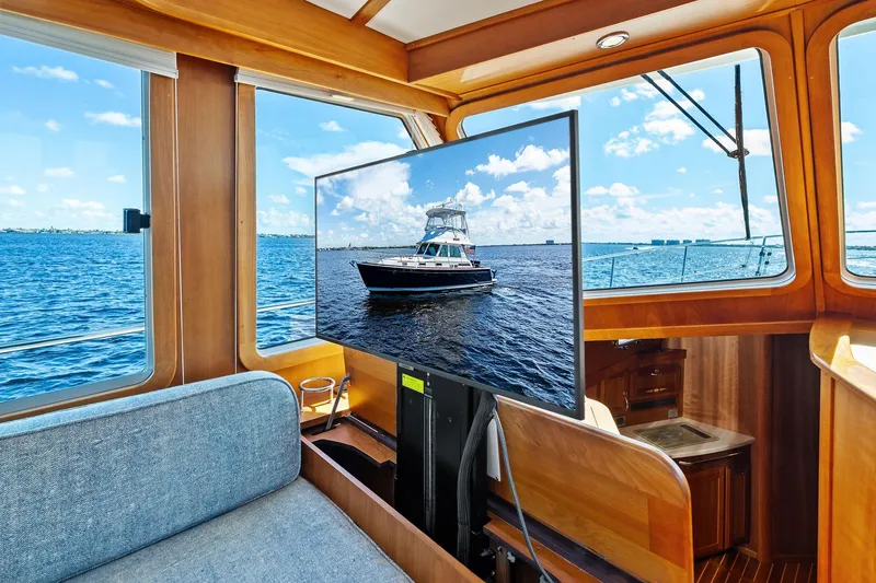 Slide: The Image of Interior of 2019 Sabre Flybridge yacht with ocean view and TV display. - 18