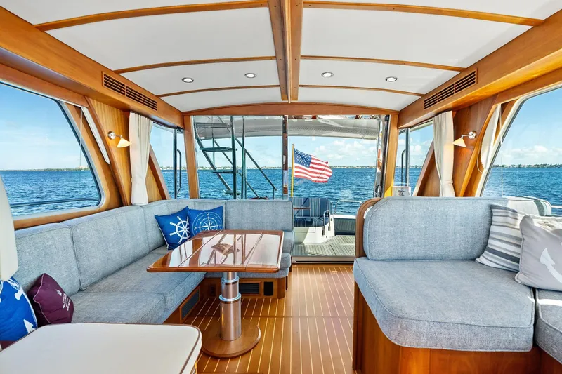 Slide: The Image of Luxurious 2019 Sabre Flybridge yacht interior with elegant wood finish and ocean view. - 2