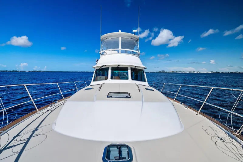 Slide: The Image of 2019 Sabre Flybridge yacht on open water under clear blue sky. - 47