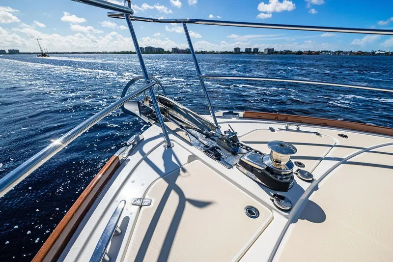 Slide: The Image of 2019 Sabre Flybridge yacht deck with ocean view and clear blue sky. - 52