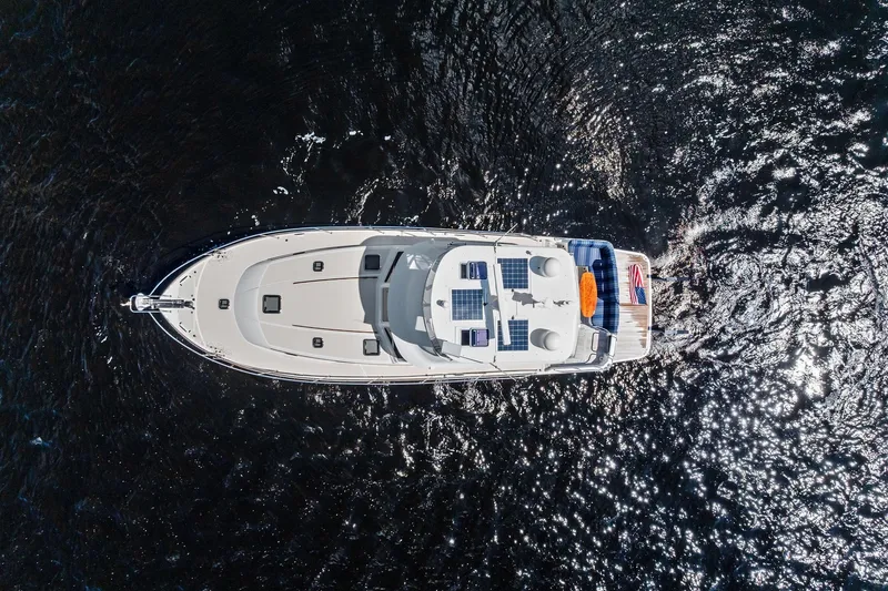 Slide: The Image of Aerial view of 2019 Sabre Flybridge yacht cruising on sparkling water. - 56