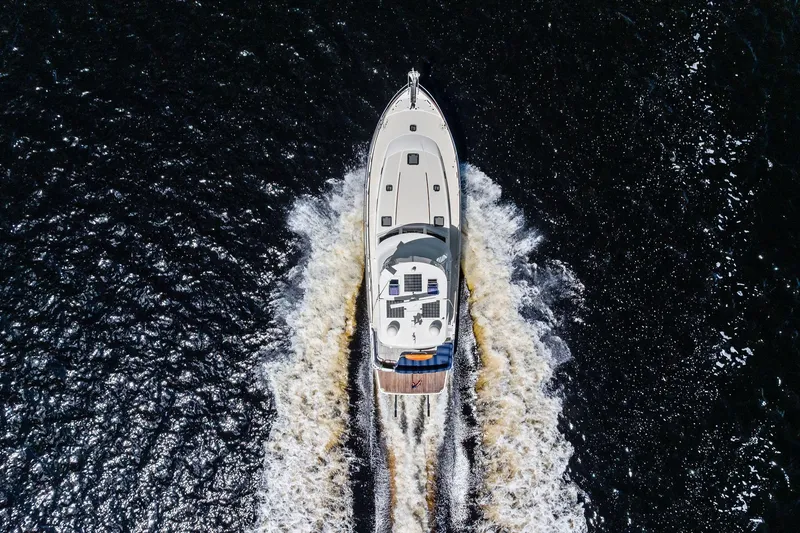 Slide: The Image of Aerial view of 2019 Sabre Flybridge yacht cruising on dark water. - 57