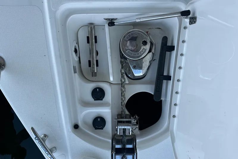 Slide: The Image of 2018 Formula 370 Super Sport boat interior with seating, canopy, and scenic water view. - 16