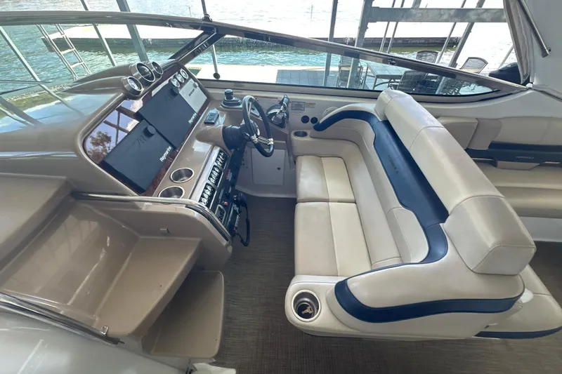Slide: The Image of 2018 Formula 370 Super Sport yacht interior with kitchenette, featuring wood cabinets and modern appliances. - 20