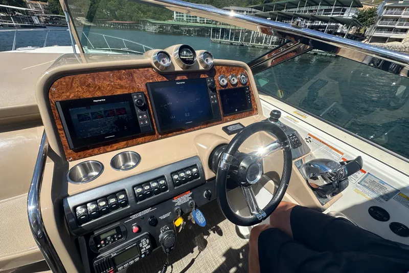 Slide: The Image of 2018 Formula 370 Super Sport boat docked, top view showing deck and water surroundings. - 34