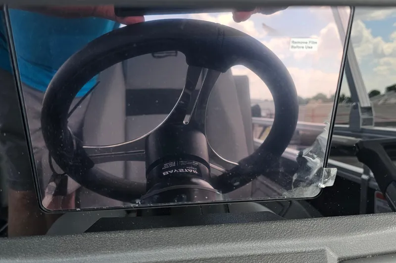 Slide: The Image of Steering wheel of 2026 Sun Tracker Sportfish 24 XP3 boat with protective film. - 14
