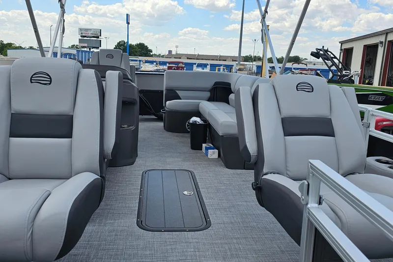 Slide: The Image of 2026 Sun Tracker Sportfish 24 XP3 pontoon boat interior with gray seating and open deck. - 6