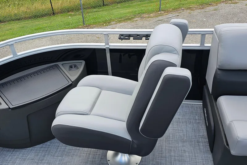 Slide: The Image of 2026 Sun Tracker Sportfish 24 XP3 boat interior with comfortable seating and sleek design. - 8