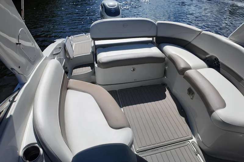 Slide: The Image of 2020 Crownline 24 boat interior with spacious seating and elegant design on the water. - 32