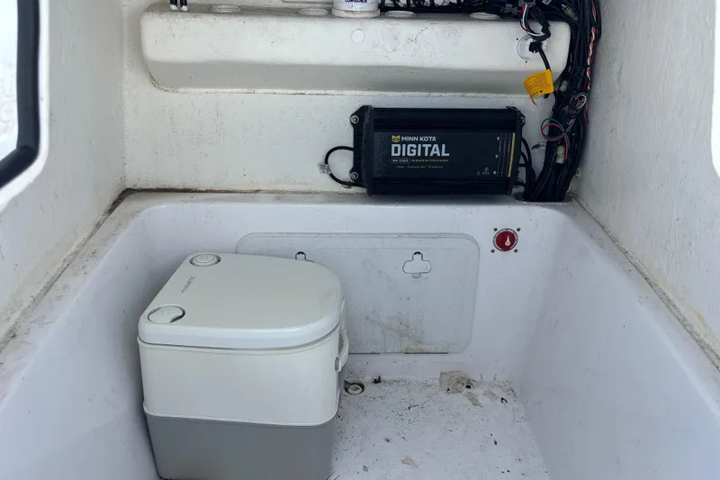 Slide: The Image of Interior of 2022 Cape Horn 22 OS boat with portable toilet and digital charger. - 31