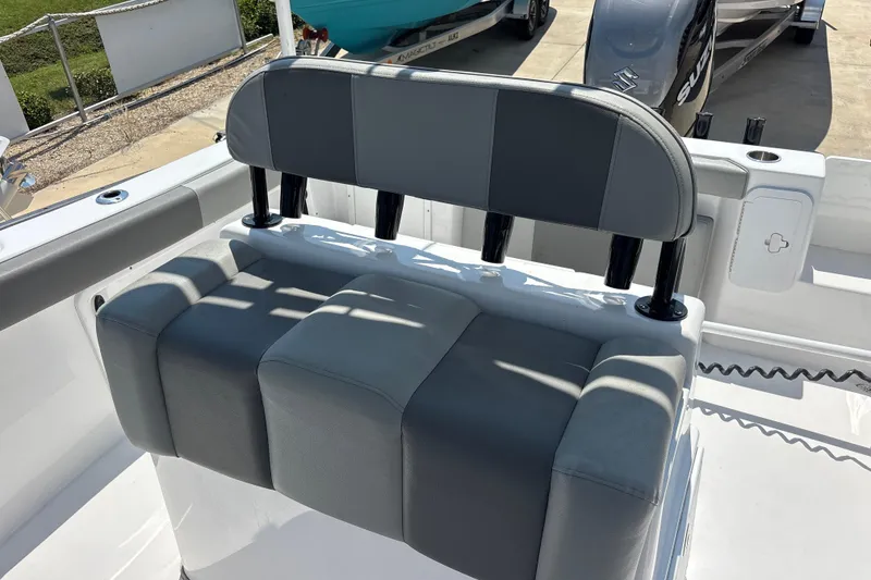Slide: The Image of 2022 Cape Horn 22 OS boat seat with rod holders, featuring gray upholstery. - 39