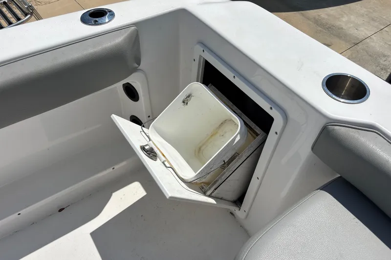 Slide: The Image of 2022 Cape Horn 22 OS boat with open storage compartment and cup holders. - 51