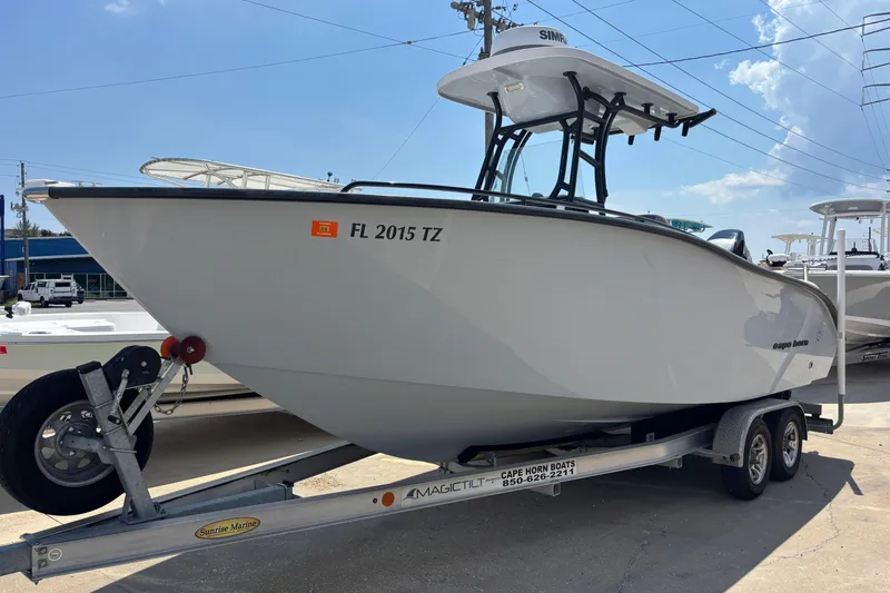Slide: The Image of 2022 Cape Horn 22 OS boat on trailer, side view, under clear blue sky. - 6