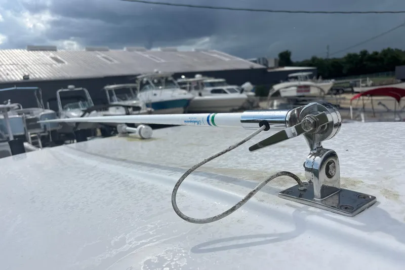 Slide: The Image of 2022 Cape Horn 22 OS boat with antenna, docked under cloudy sky. - 62