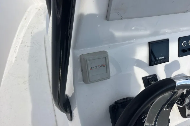 Slide: The Image of 2022 Cape Horn 22 OS boat dashboard with Optimus EPS and Suzuki controls. - 69