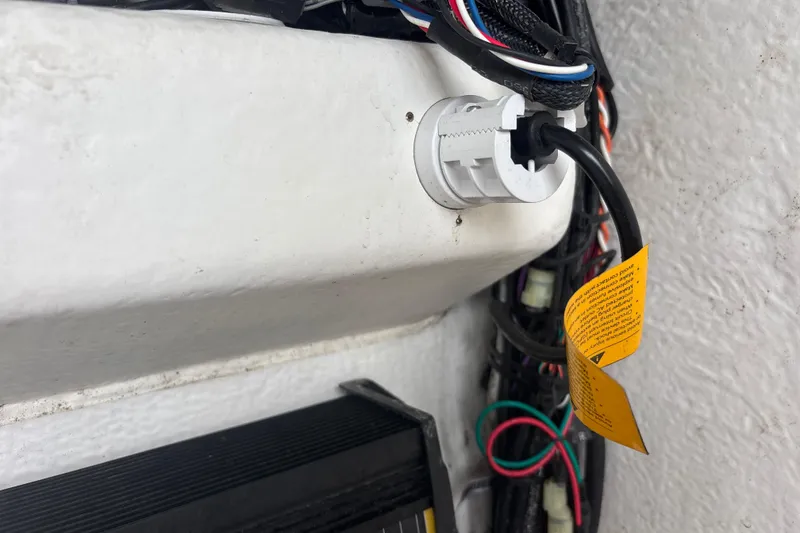 Slide: The Image of 2022 Cape Horn 22 OS boat wiring detail with cables and connectors. - 76