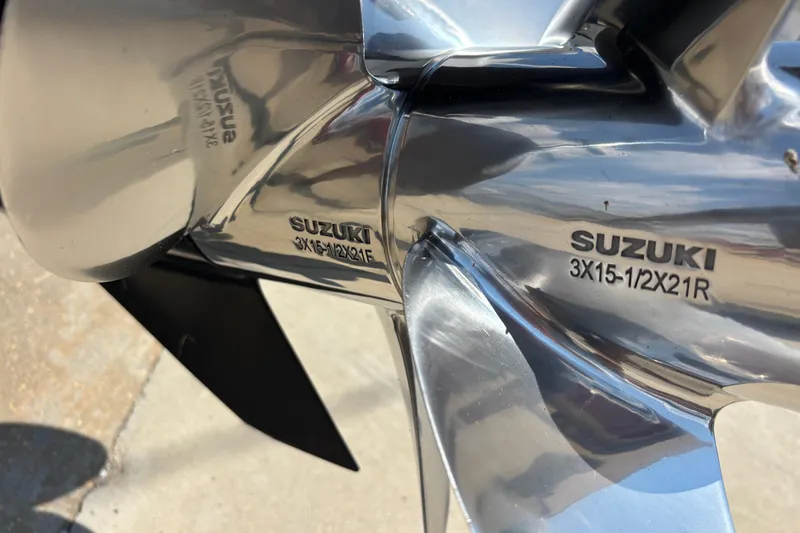 Slide: The Image of Close-up of a Suzuki propeller on a 2022 Cape Horn 22 OS boat. - 12