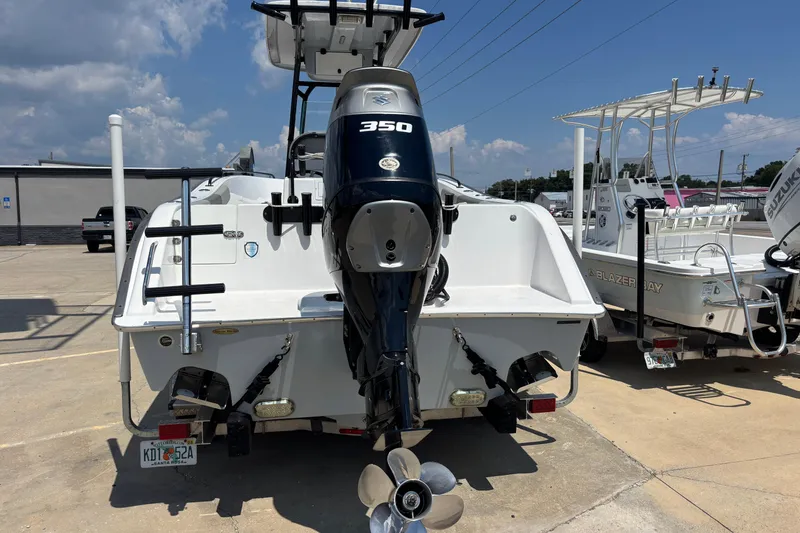 Slide: The Image of 2022 Cape Horn 22 OS boat with powerful 350 engine, parked outdoors. - 13