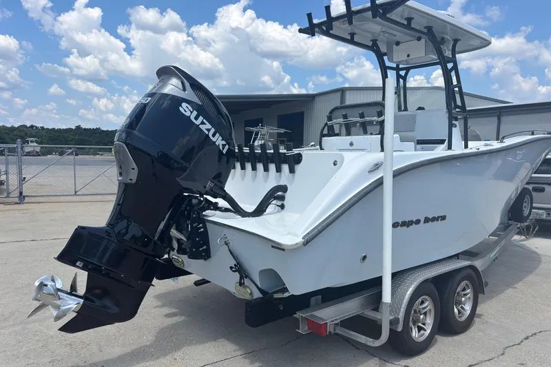 Slide: The Image of 2022 Cape Horn 22 OS boat with Suzuki outboard motor on trailer. - 2