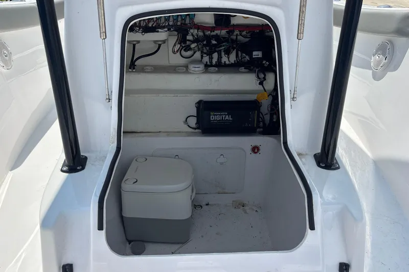 Slide: The Image of 2022 Cape Horn 22 OS boat interior with storage and portable toilet. - 32