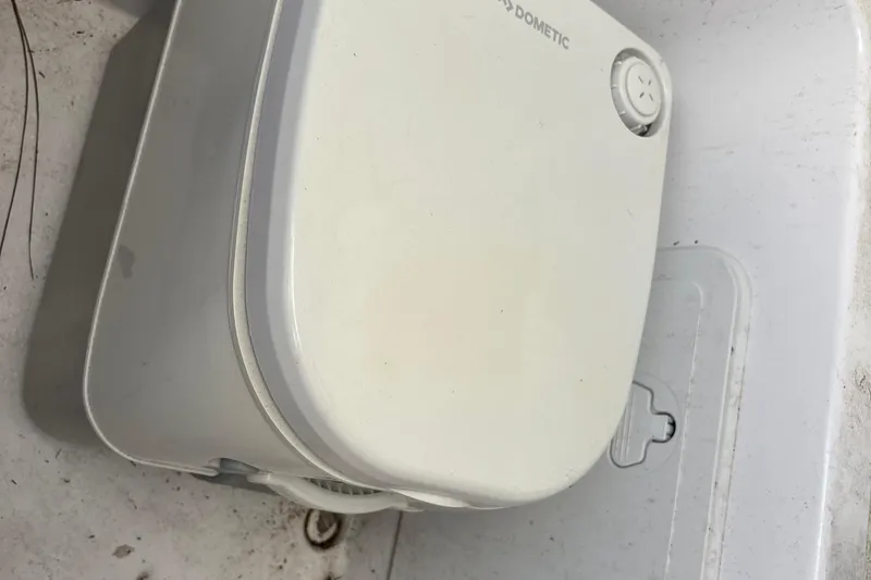 Slide: The Image of Dometic appliance on 2022 Cape Horn 22 OS boat, white and compact design. - 37