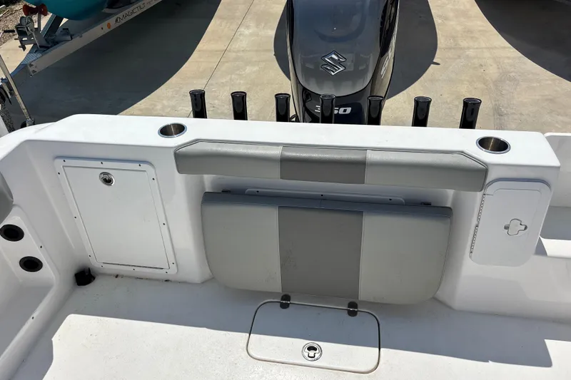 Slide: The Image of 2022 Cape Horn 22 OS boat interior with seating and Suzuki outboard motor. - 43
