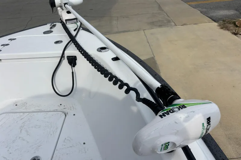 Slide: The Image of 2022 Cape Horn 22 OS boat with a mounted trolling motor on the deck. - 57