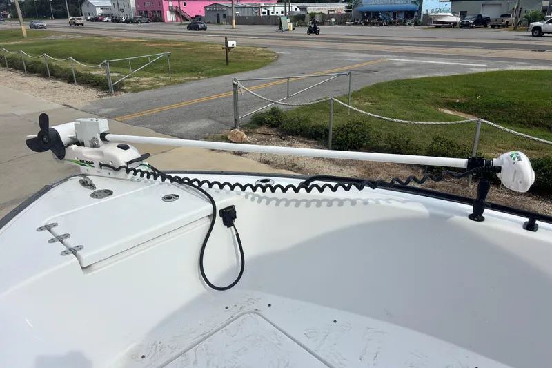 Slide: The Image of 2022 Cape Horn 22 OS boat with trolling motor, parked near a road. - 59