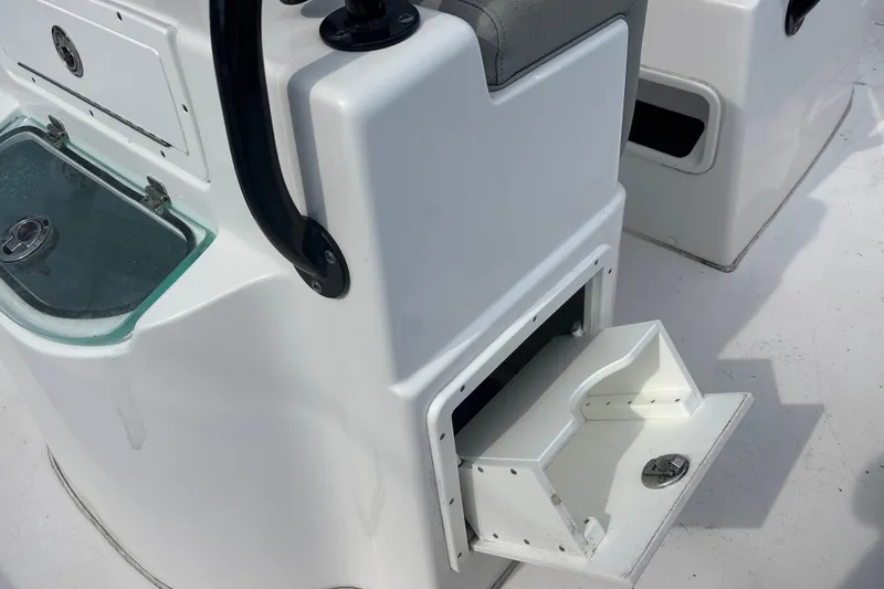 Slide: The Image of 2022 Cape Horn 22 OS boat interior with open storage compartment and seating. - 64