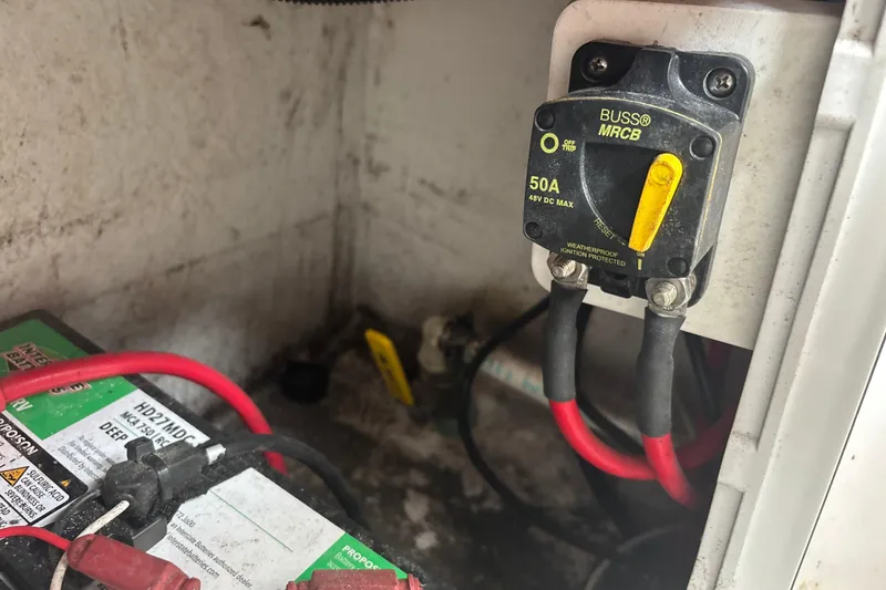 Slide: The Image of Electrical setup in a 2022 Cape Horn 22 OS boat, featuring a 50A circuit breaker. - 70