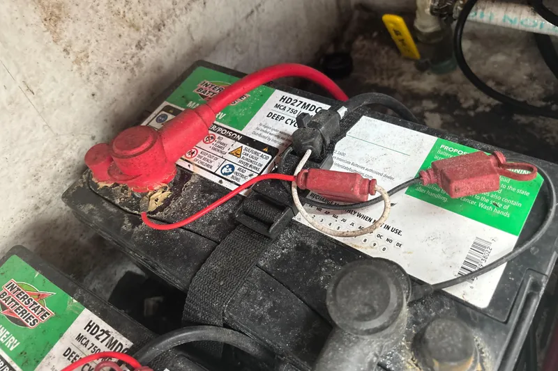 Slide: The Image of Battery setup in a 2022 Cape Horn 22 OS boat, featuring Interstate deep cycle battery. - 73