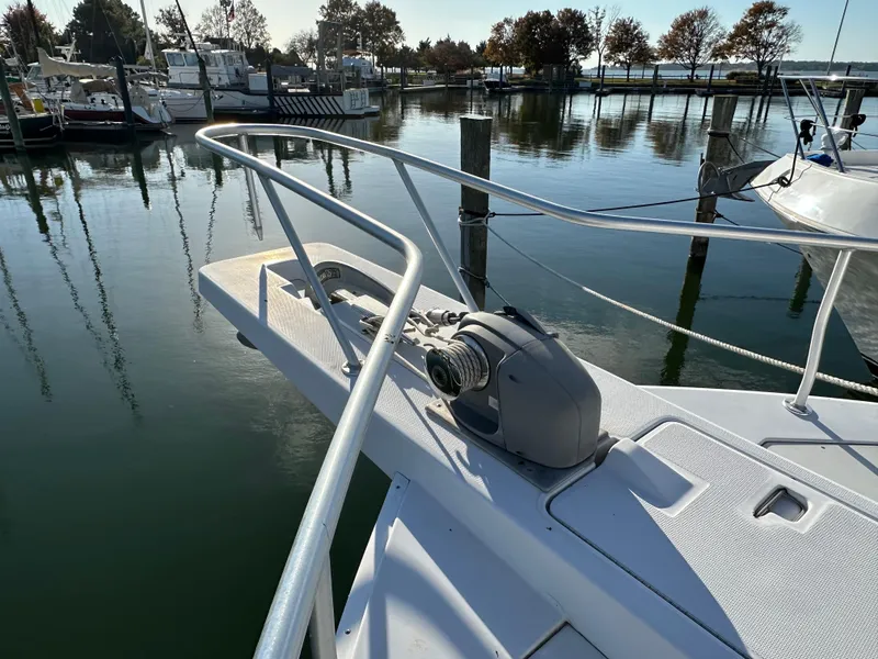 Slide: The Image of Mainship 43 Trawler Aft Cabin 2000, bow view at marina with calm water. - 14